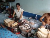 Myanmar laborers grinding squid in their rented room

Report
Date Taken: September 14, 2010
Place: Inside a rented room in a Myanmar community in Samut Songkhram province, Thailand
Taken by: Nobpaon Rabibhadana
